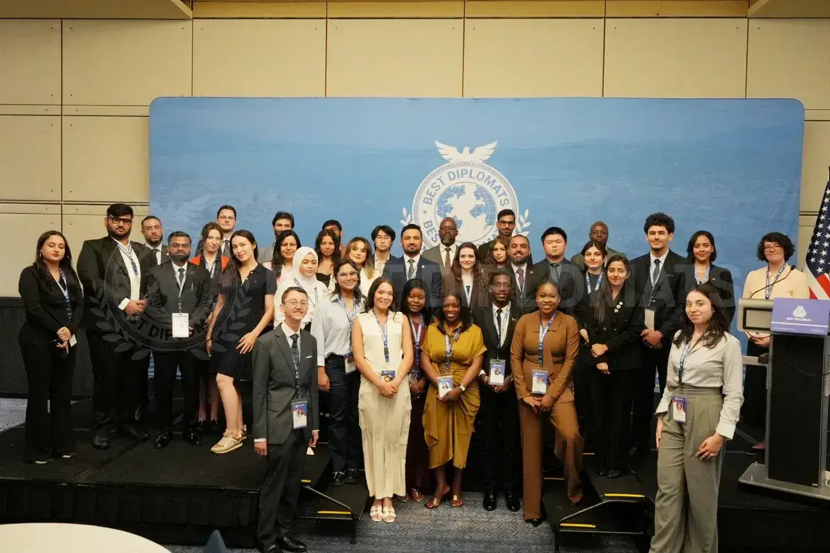 Group photo of the Geneva delegation on stage