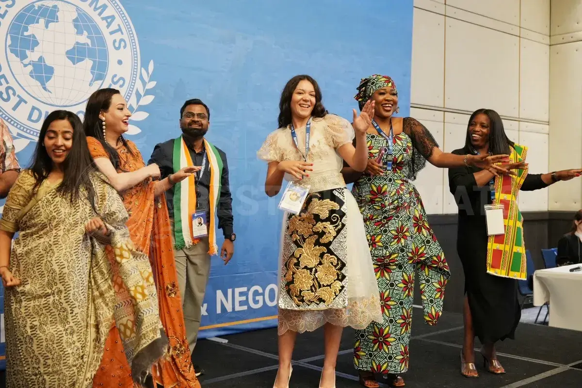 Delegates dancing on stage in Geneva